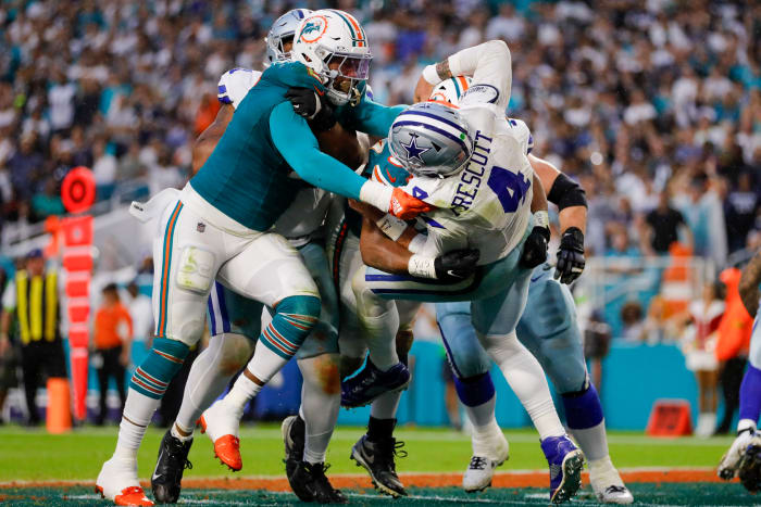 Dolphins defensive tackle Christian Wilkins (94) and linebacker Bradley Chubb (2) tackle Dallas Cowboys quarterback Dak Prescott (4) during the second quarter at Hard Rock Stadium.